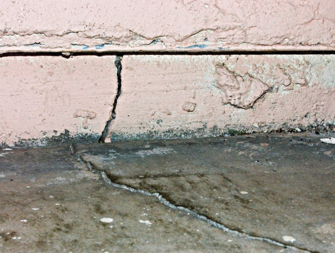 A foundation crack leading to water leaking into a basement.